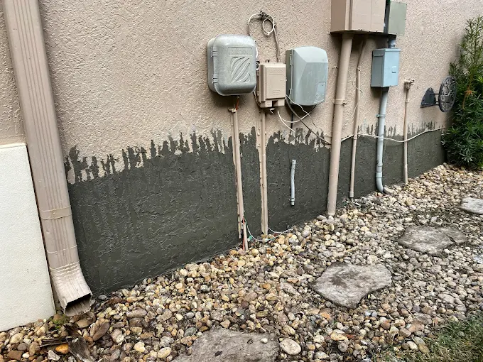 Damaged stucco wall before repair in Fort Lauderdale residential property